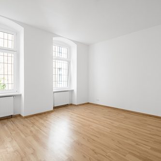 empty room, wooden floor in new apartment